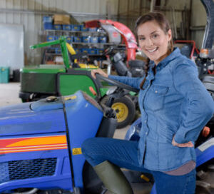 mechanical female in a tractor garage
