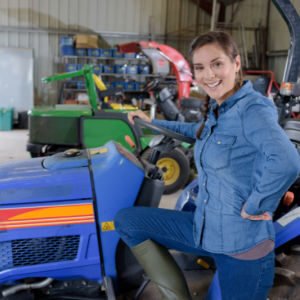 mechanical female in a tractor garage